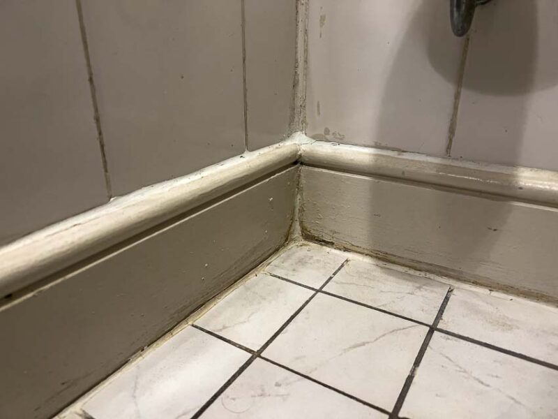smeared caulk on tile corners
